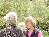 Pamela, Ivan & Janet chat, Cliff in the background