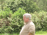 Pamela, Ivan & Janet chat, Cliff in the background